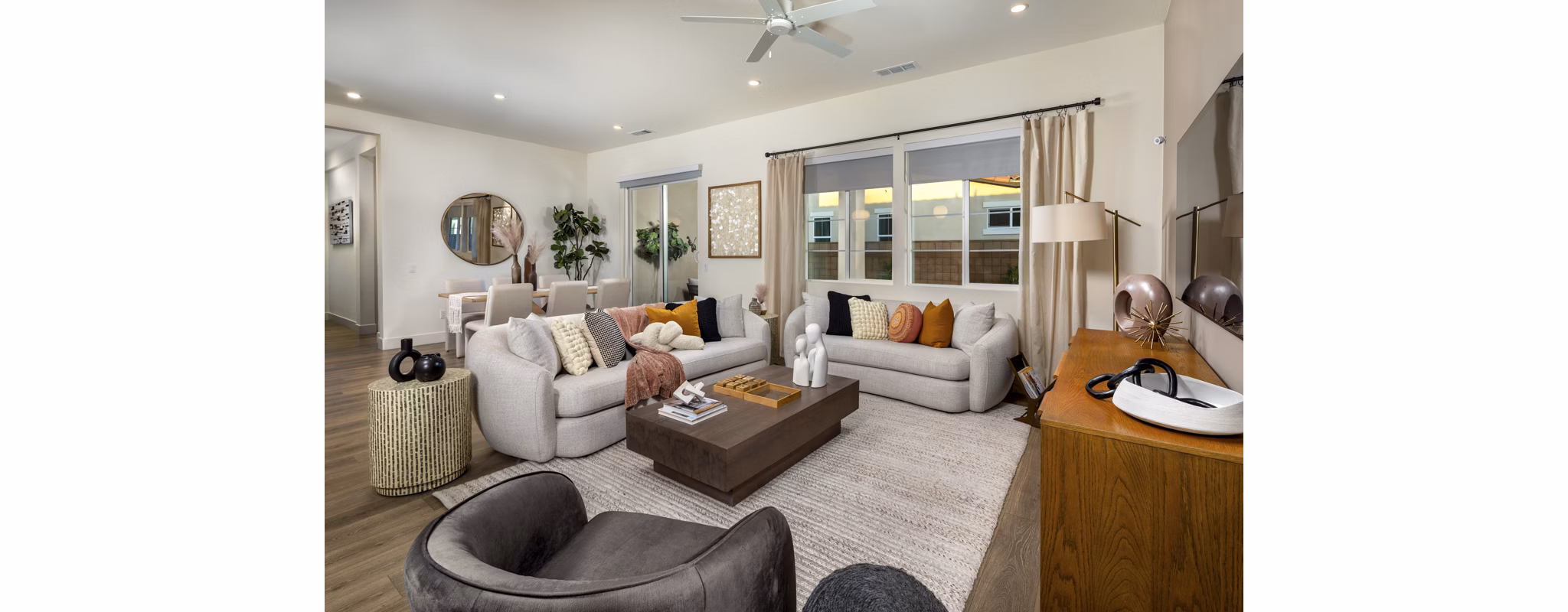 Living room with sleek furniture and large windows at SolTerra Apartments, luxury Greystar property