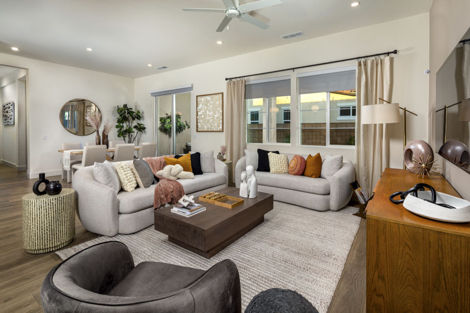 Living room with sleek furniture and large windows at SolTerra Apartments, luxury Greystar property