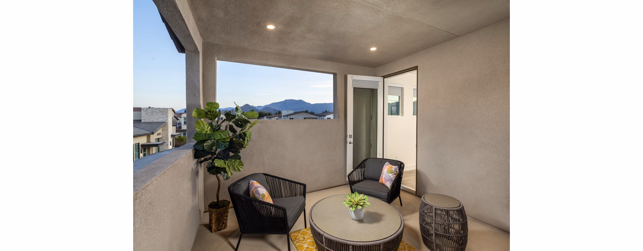 Spacious outdoor patio with modern furniture at SolTerra Apartments, perfect for entertaining or relaxing in a luxury setting