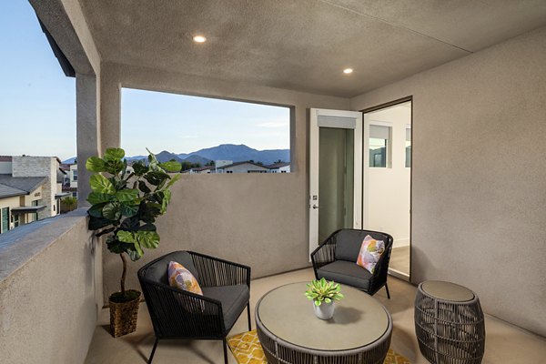Spacious outdoor patio with modern furniture at SolTerra Apartments, perfect for entertaining or relaxing in a luxury setting