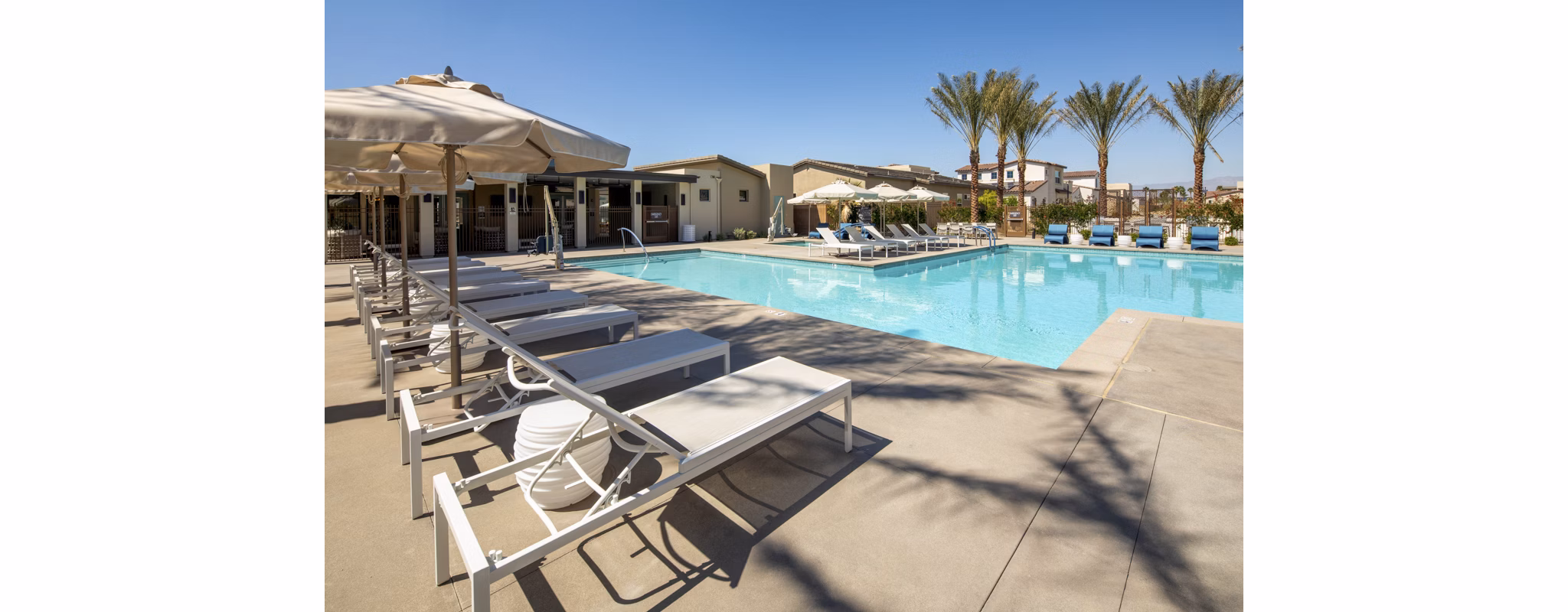 Resort-style pool with lounge chairs at SolTerra Apartments, a luxury Greystar community