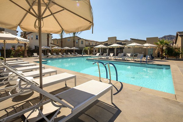 Resort-style pool with lounge chairs at SolTerra Apartments, a Greystar luxury community offering comfort and relaxation