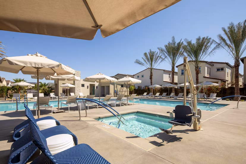 Resort-style pool with sun loungers at SolTerra Apartments, offering luxury amenities for a premium lifestyle experience