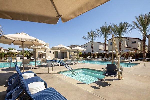 Resort-style pool with sun loungers at SolTerra Apartments, offering luxury amenities for a premium lifestyle experience