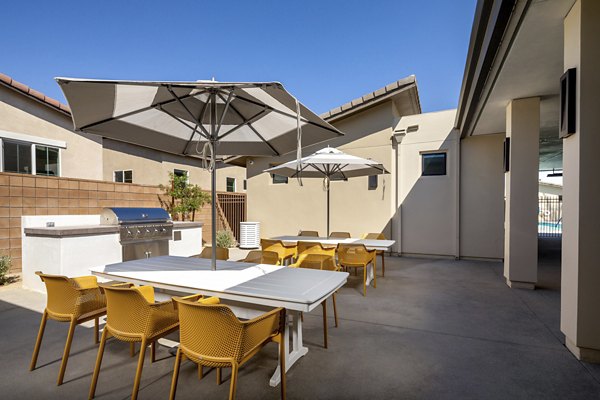 Spacious outdoor grill area with modern seating at SolTerra Apartments, perfect for entertaining in a luxury setting