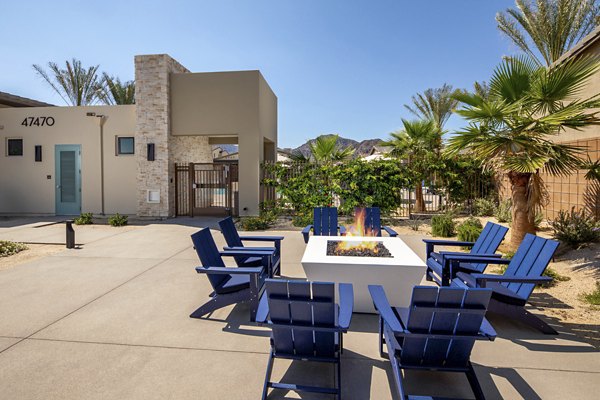 Cozy fire pit area at SolTerra Apartments, featuring comfortable seating and ambient lighting in a luxury apartment community