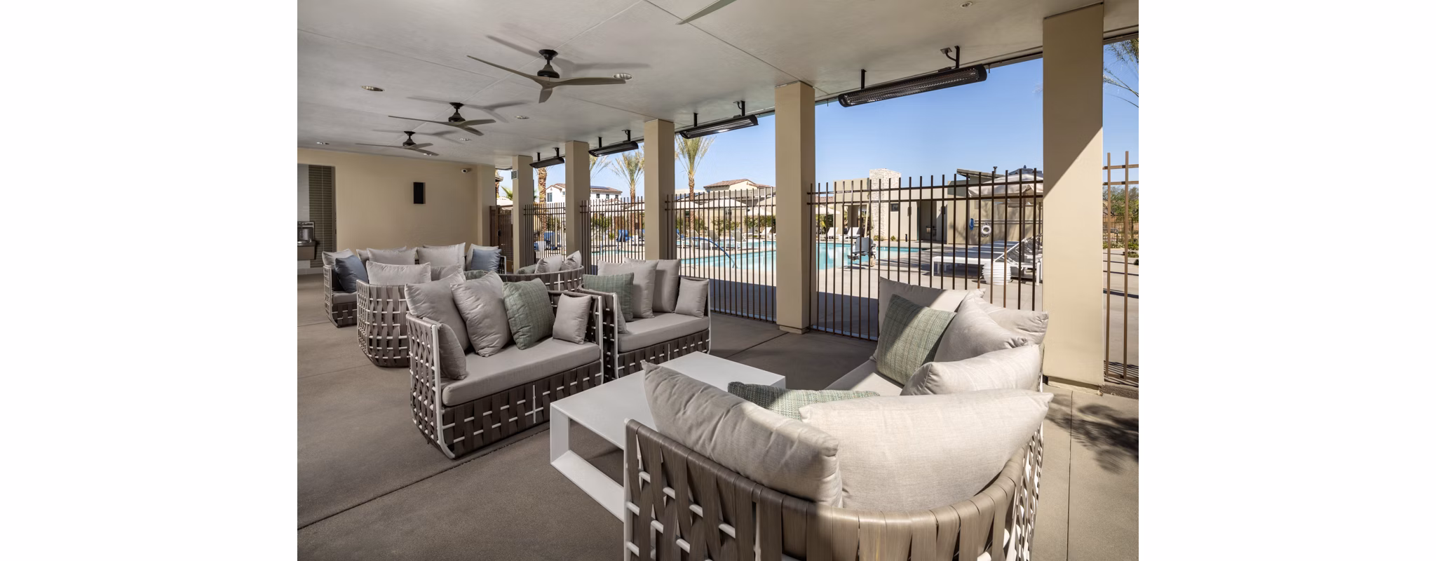 Outdoor patio with cozy seating at SolTerra Apartments, perfect for relaxation and social gatherings in a vibrant community setting