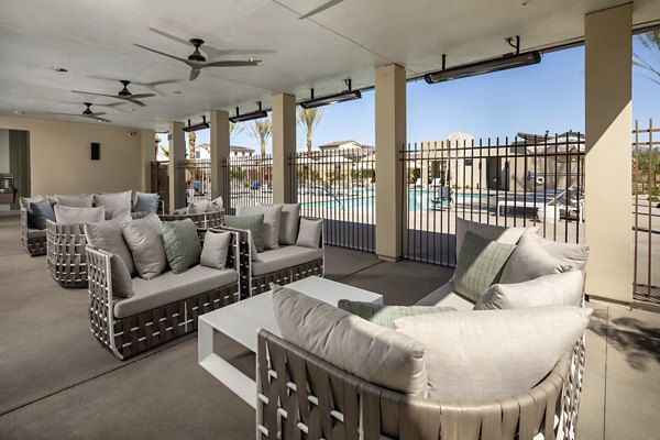 Outdoor patio with cozy seating at SolTerra Apartments, perfect for relaxation and social gatherings in a vibrant community setting