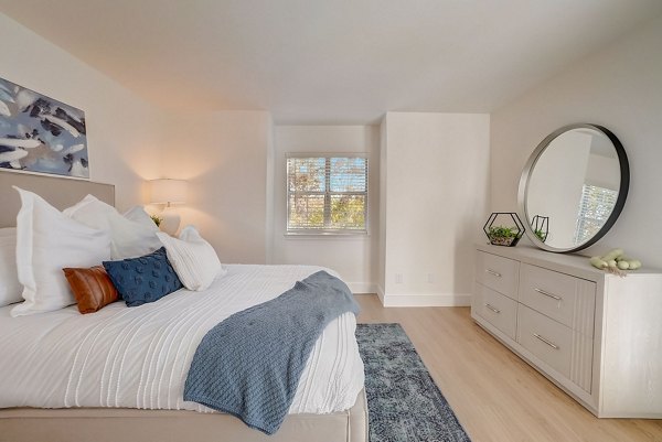 Contemporary bedroom with elegant furnishings at Brentwood Oaks Apartments offering luxury living