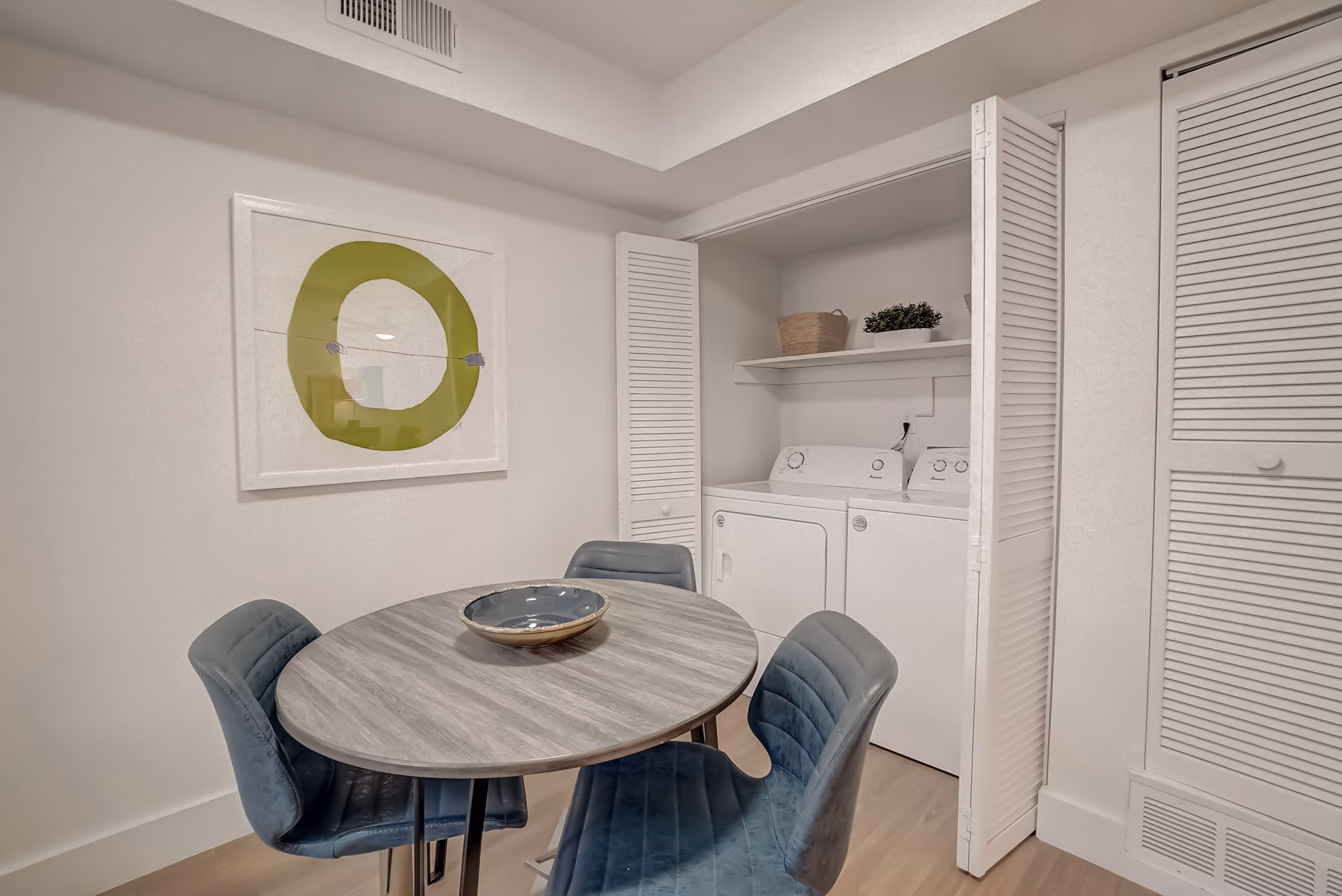 Dining area with modern decor and natural light at Brentwood Oaks Apartments, part of Greystar's luxury living portfolio in a serene setting