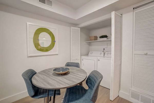 Dining area with modern decor and natural light at Brentwood Oaks Apartments, part of Greystar's luxury living portfolio in a serene setting