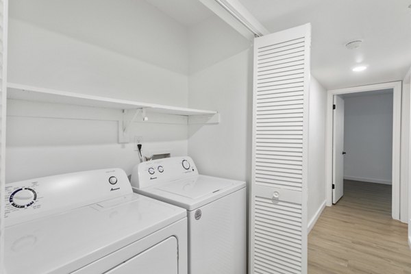 Laundry room with modern appliances at Brentwood Oaks Apartments