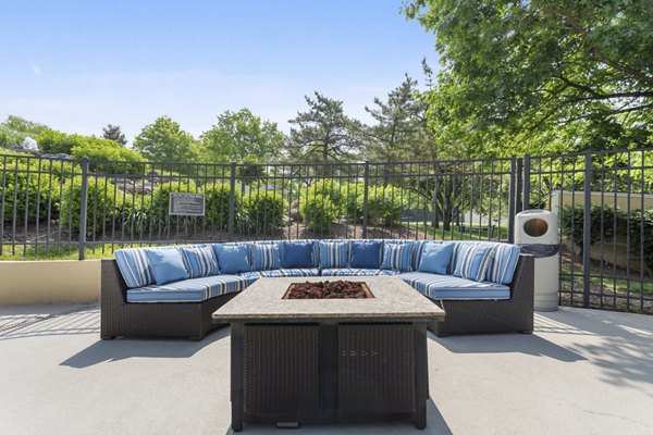 Cozy fire pit area at Brentwood Oaks Apartments, perfect for socializing and relaxing under the stars in a luxury setting