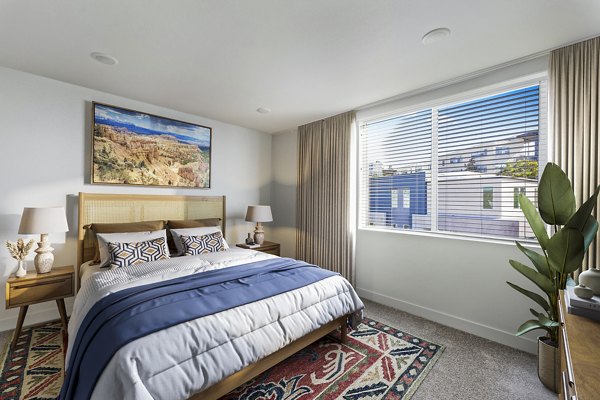 Cozy bedroom with elegant decor at Ascent at Campus of Life Apartments