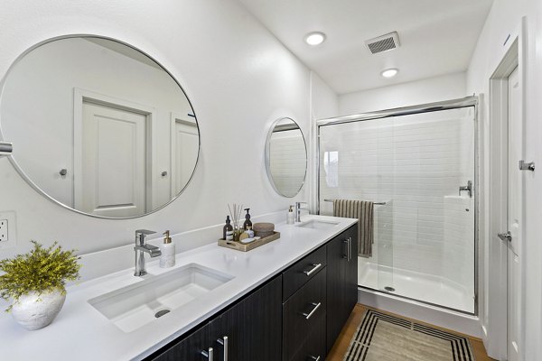 Contemporary bathroom with sleek fixtures at Ascent at Campus of Life Apartments