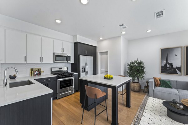 Modern kitchen with stainless steel appliances at Ascent at Campus of Life Apartments