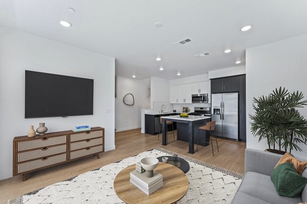 Spacious living room with modern decor at Ascent at Campus of Life Apartments