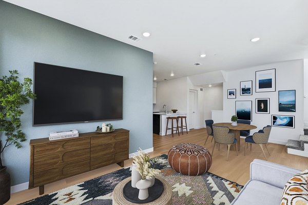 Spacious living room with modern decor at Ascent at Campus of Life Apartments