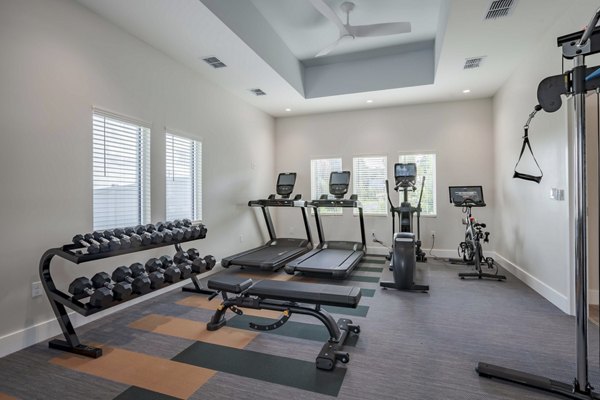 State-of-the-art fitness center with modern equipment at Eden Magnolia Village Apartments