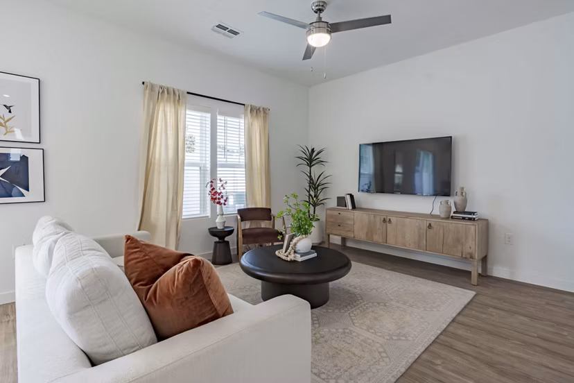 Living room with contemporary decor at Adaptive Image Eden Magnolia Village Apartments