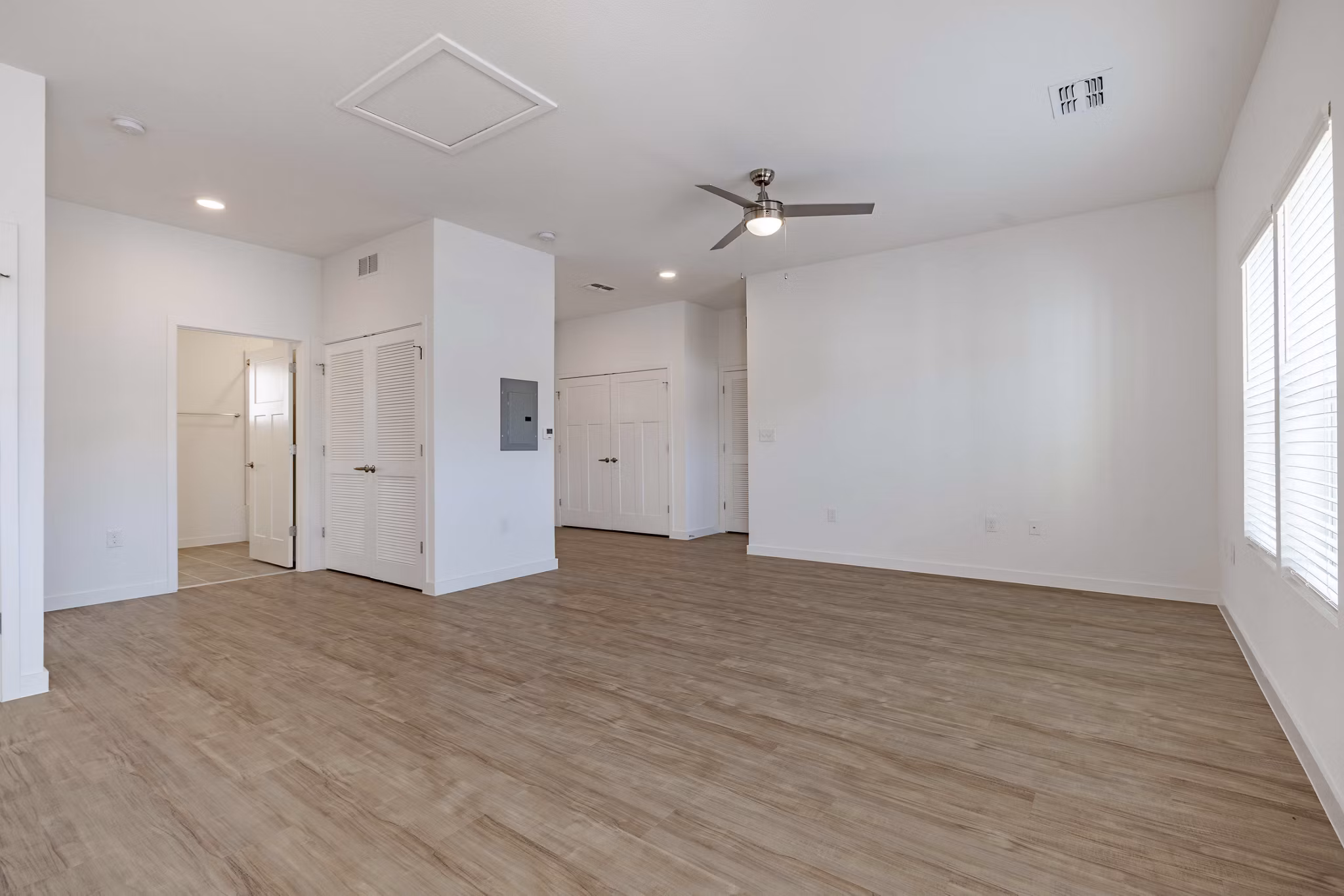 Living room featuring modern decor and natural light at Eden Magnolia Village Apartments