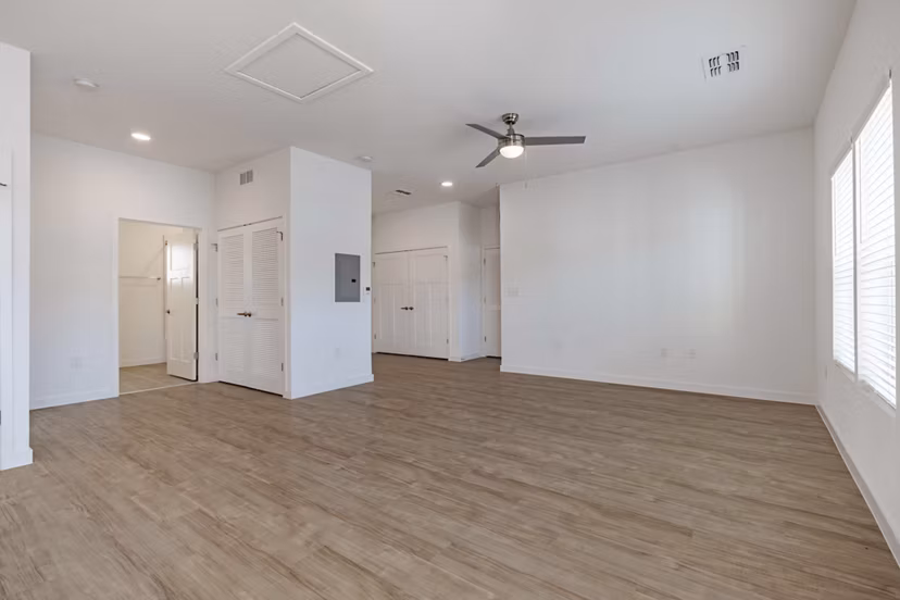 Living room featuring modern decor and natural light at Eden Magnolia Village Apartments