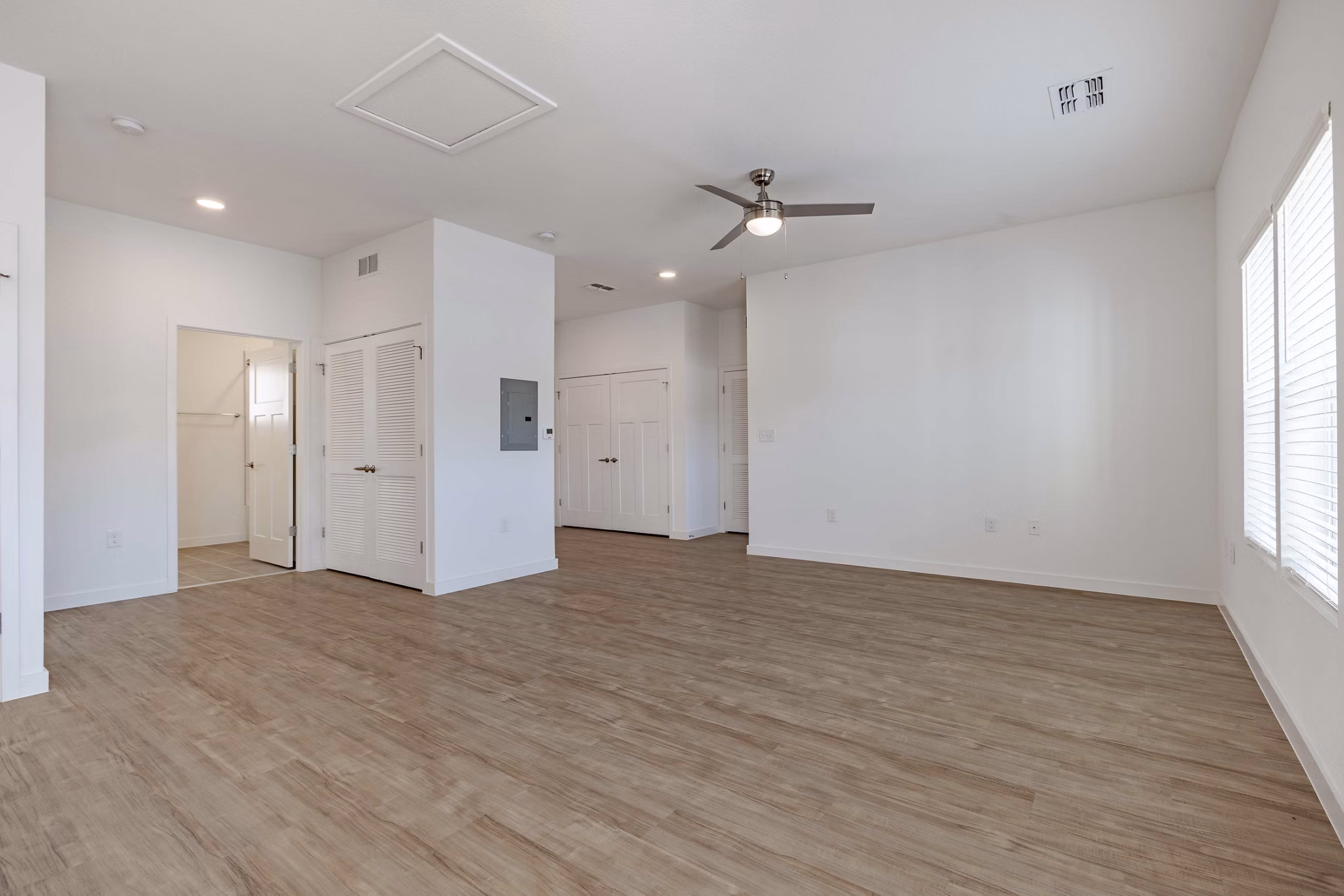 Living room featuring modern decor and natural light at Eden Magnolia Village Apartments