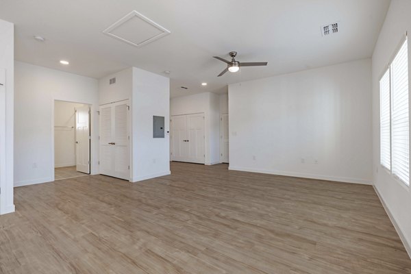 Living room featuring modern decor and natural light at Eden Magnolia Village Apartments