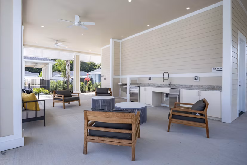 Patio with modern seating and greenery at Eden Magnolia Village Apartments in Seattle