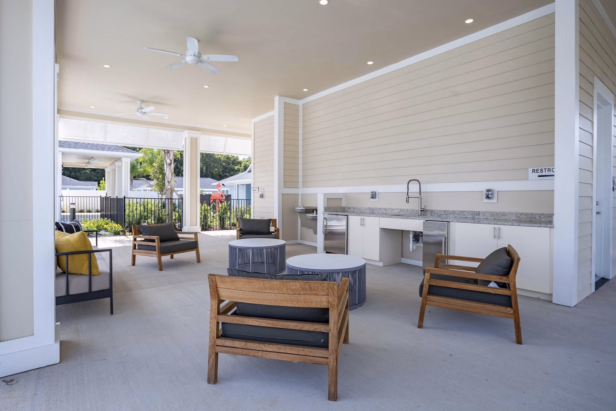 Patio with modern seating and greenery at Eden Magnolia Village Apartments in Seattle