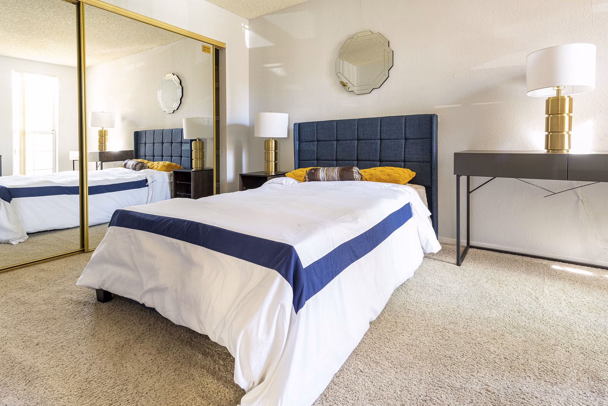 Spacious bedroom with modern decor at Sundance Apartments, featuring luxury finishes and ample natural light