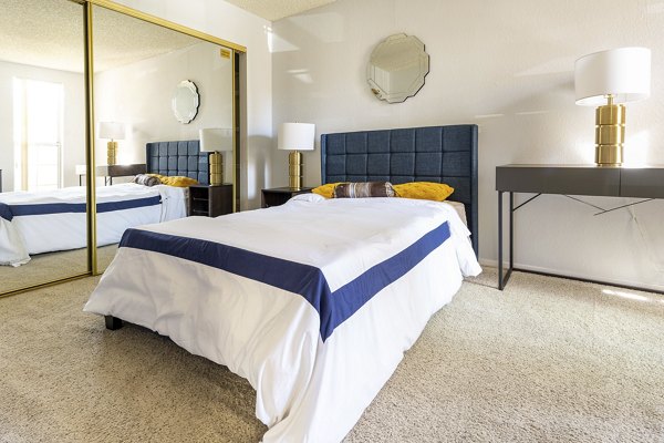 Spacious bedroom with modern decor at Sundance Apartments, featuring luxury finishes and ample natural light