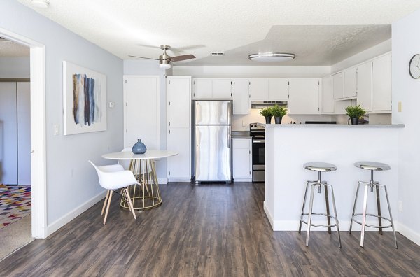 Sundance Apartments: Modern kitchen with stainless steel appliances and granite countertops