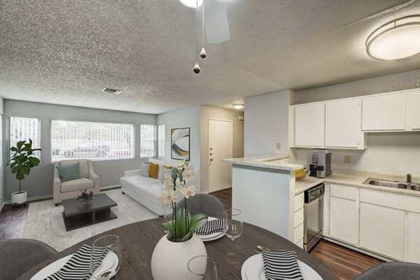 Sleek kitchen featuring stainless steel appliances at Sundance Apartments, offering luxury living spaces for residents