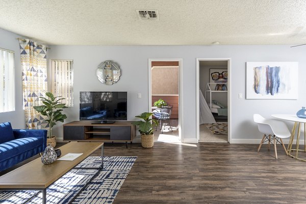 Modern living room with sleek furnishings at Sundance Apartments
