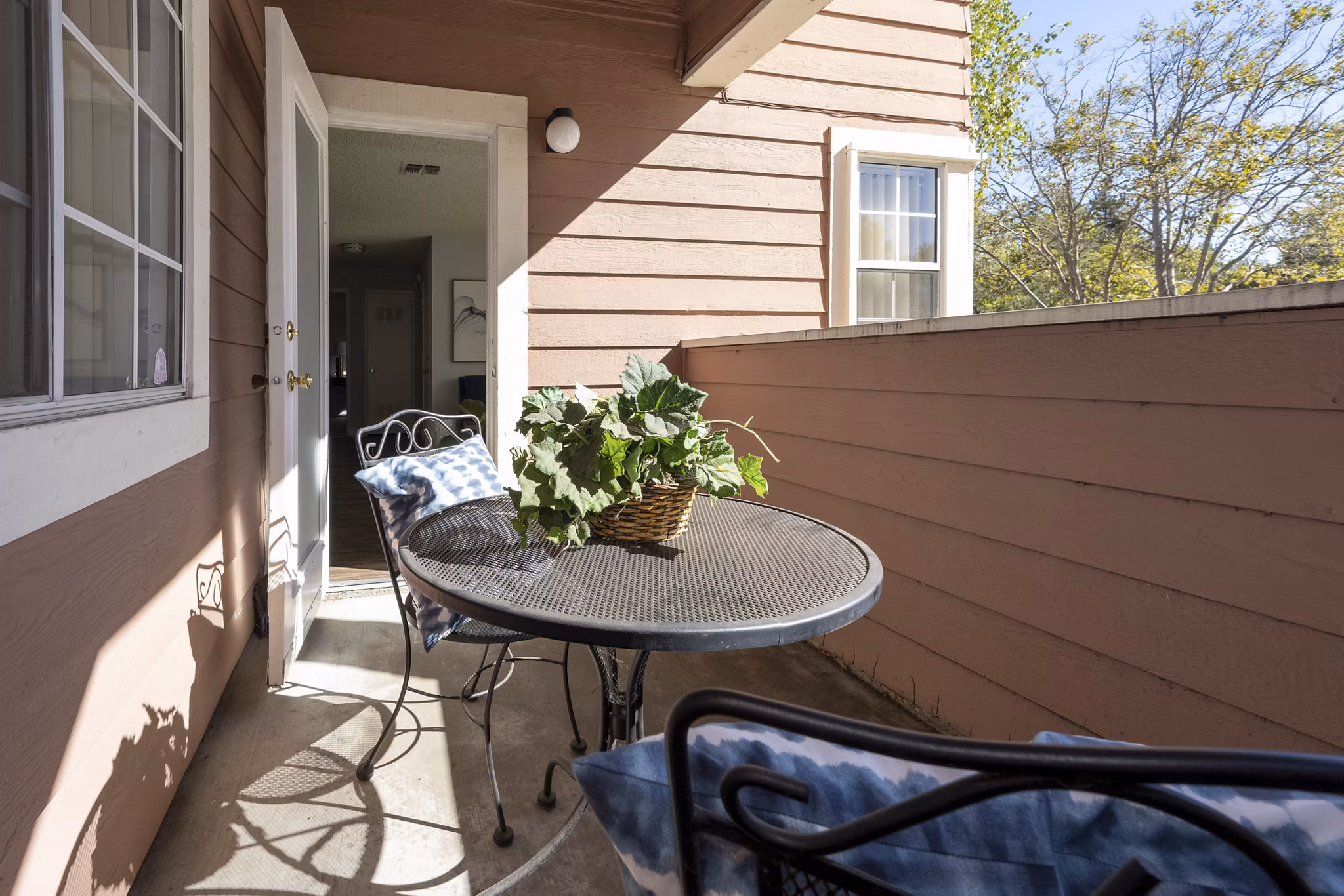 Inviting patio with outdoor seating at Sundance Apartments, perfect for relaxation and social gatherings in a luxurious setting
