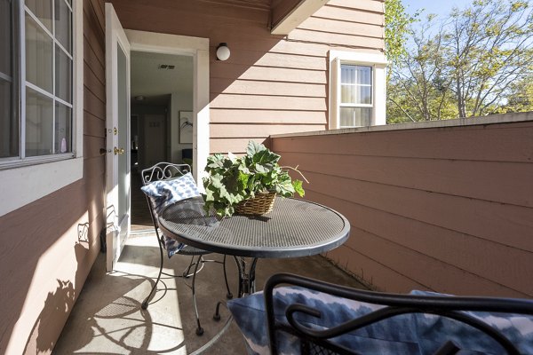 Inviting patio with outdoor seating at Sundance Apartments, perfect for relaxation and social gatherings in a luxurious setting