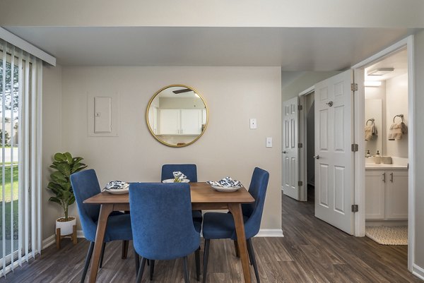 Dining area with modern furnishings and natural light at Haven on Long Grove Apartments