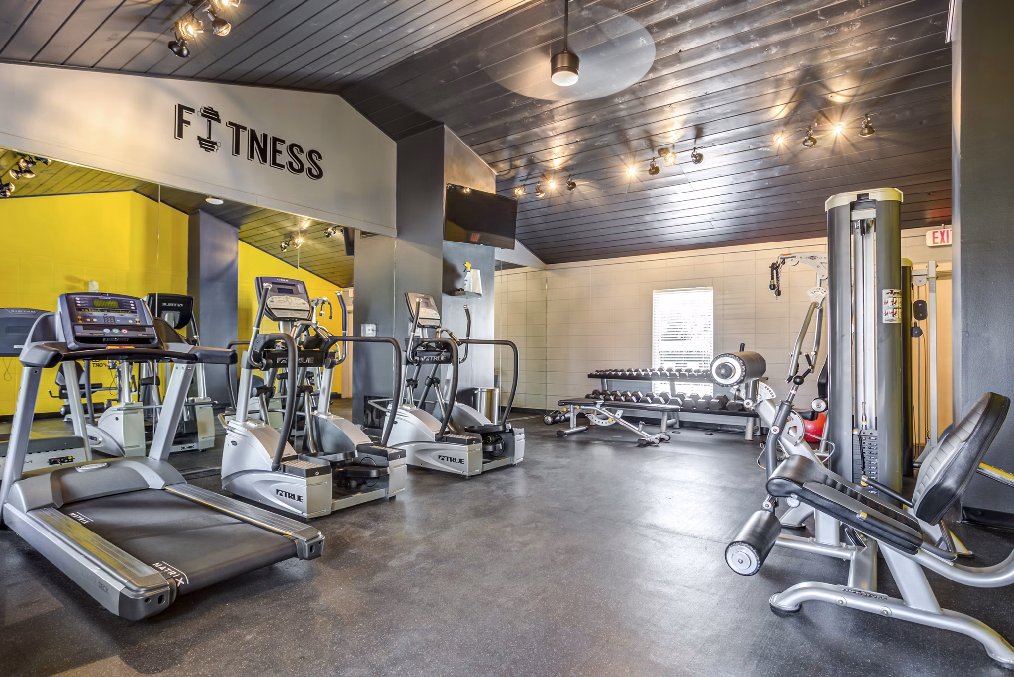 Fitness center at Haven on Long Grove Apartments featuring state-of-the-art equipment in a modern workout space