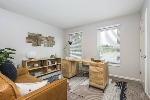 Home office with modern desk and ergonomic chair in Haven on Long Grove Apartments