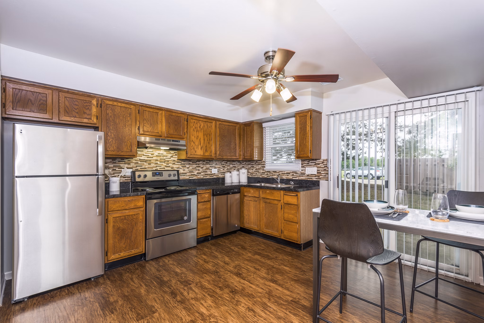 Modern kitchen with stainless steel appliances in Haven on Long Grove Apartments