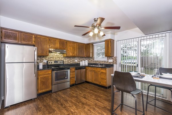 Modern kitchen with stainless steel appliances in Haven on Long Grove Apartments