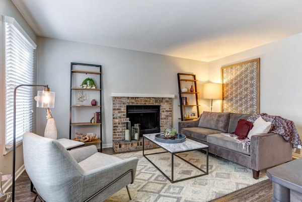 Modern living room with plush seating and large windows at Haven on Long Grove Apartments