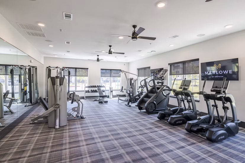 fitness center at Marlowe Denton Apartments 