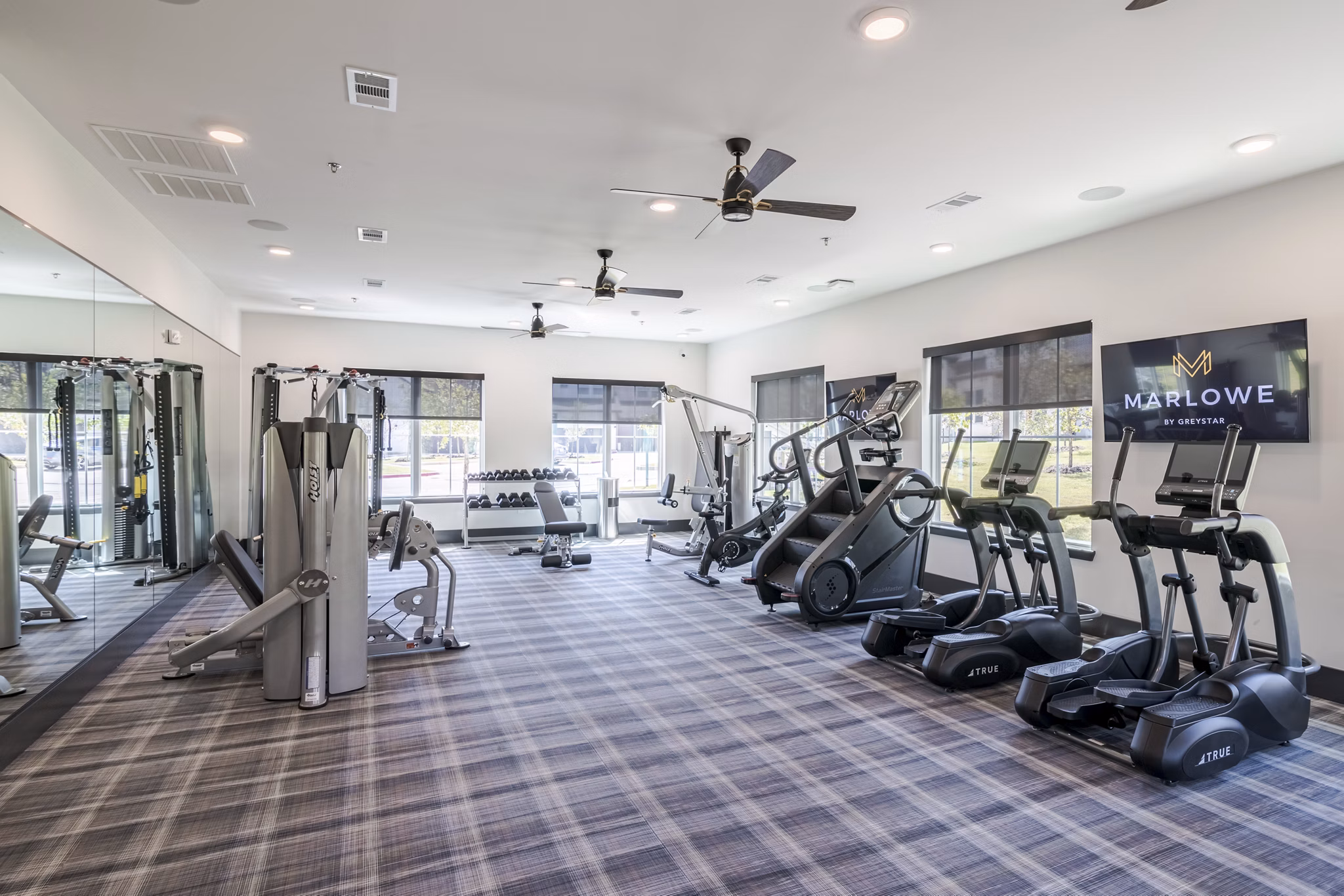 fitness center at Marlowe Denton Apartments 