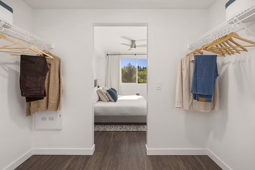Cozy bedroom with contemporary decor at Prose Kent Station Apartments, featuring plush bedding and ample natural light