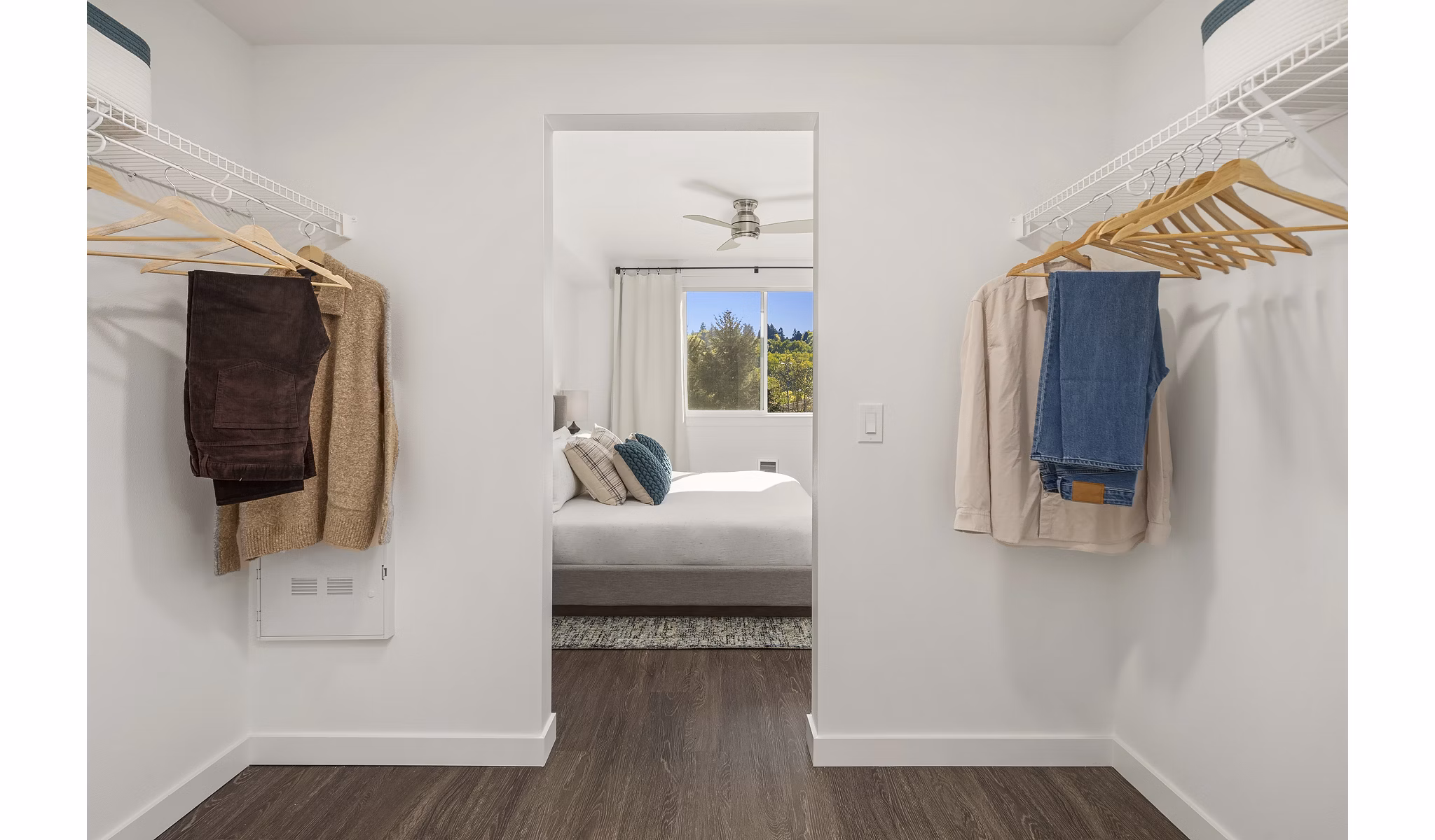 Cozy bedroom with contemporary decor at Prose Kent Station Apartments, featuring plush bedding and ample natural light