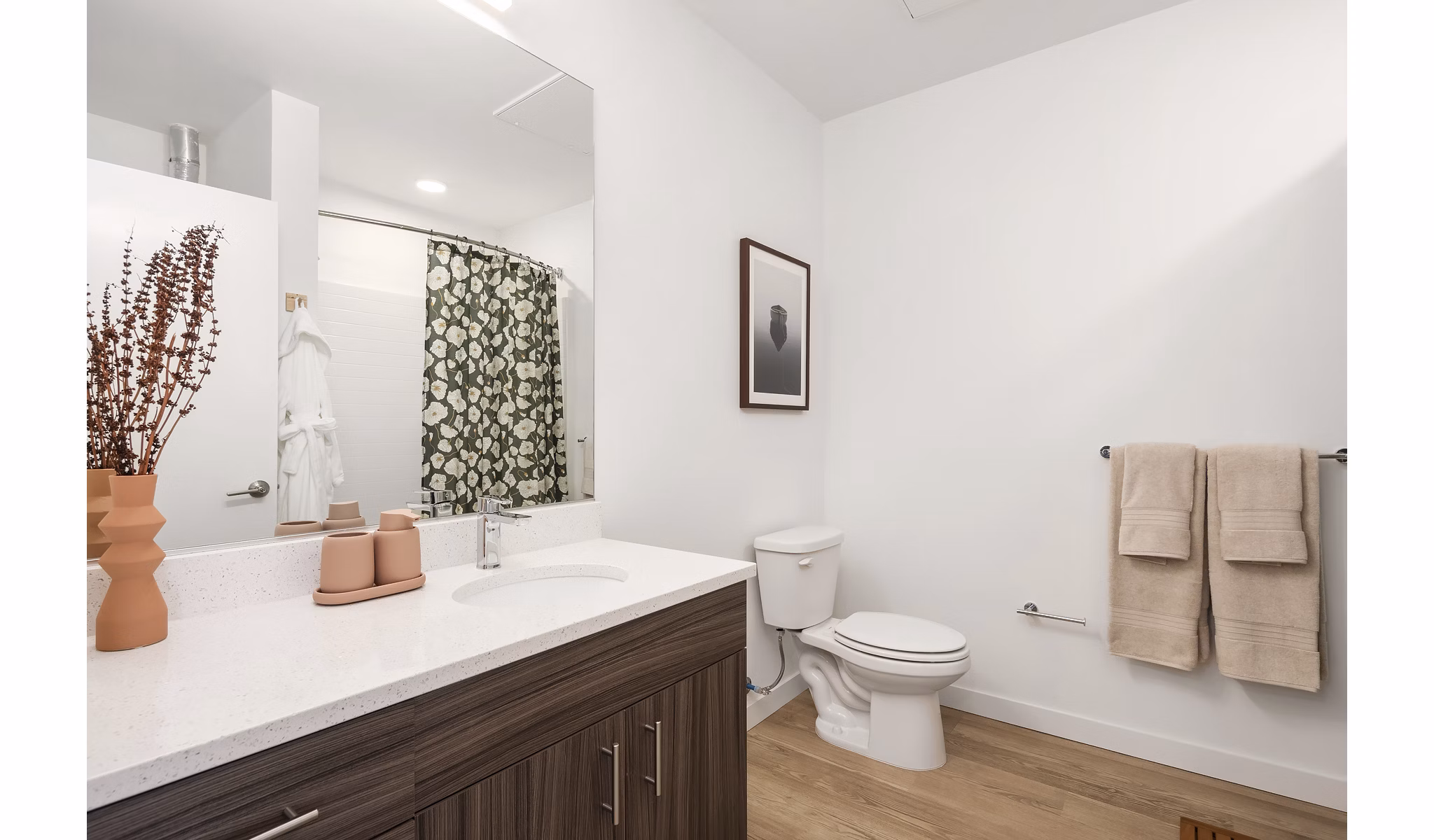 Bright bathroom with modern fixtures at Prose Kent Station Apartments, featuring a luxurious vanity and spacious shower area