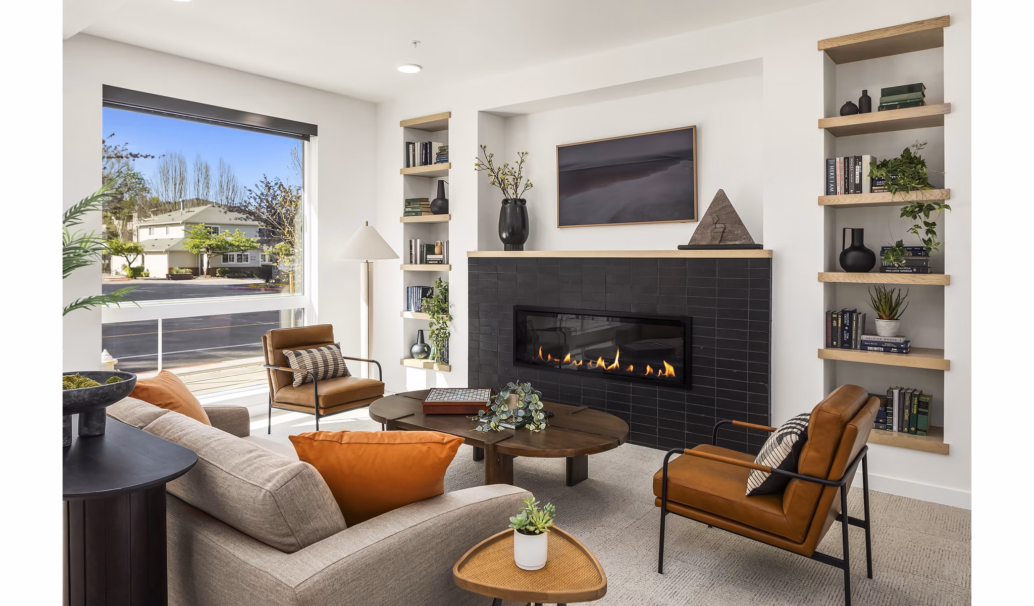 Clubhouse with modern design and seating areas at Prose Kent Station Apartments in Kent, offering luxurious community spaces