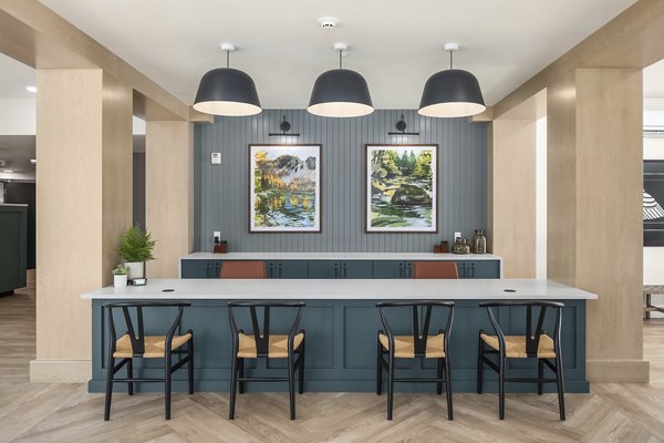 Clubhouse featuring modern design and cozy seating at Prose Kent Station Apartments